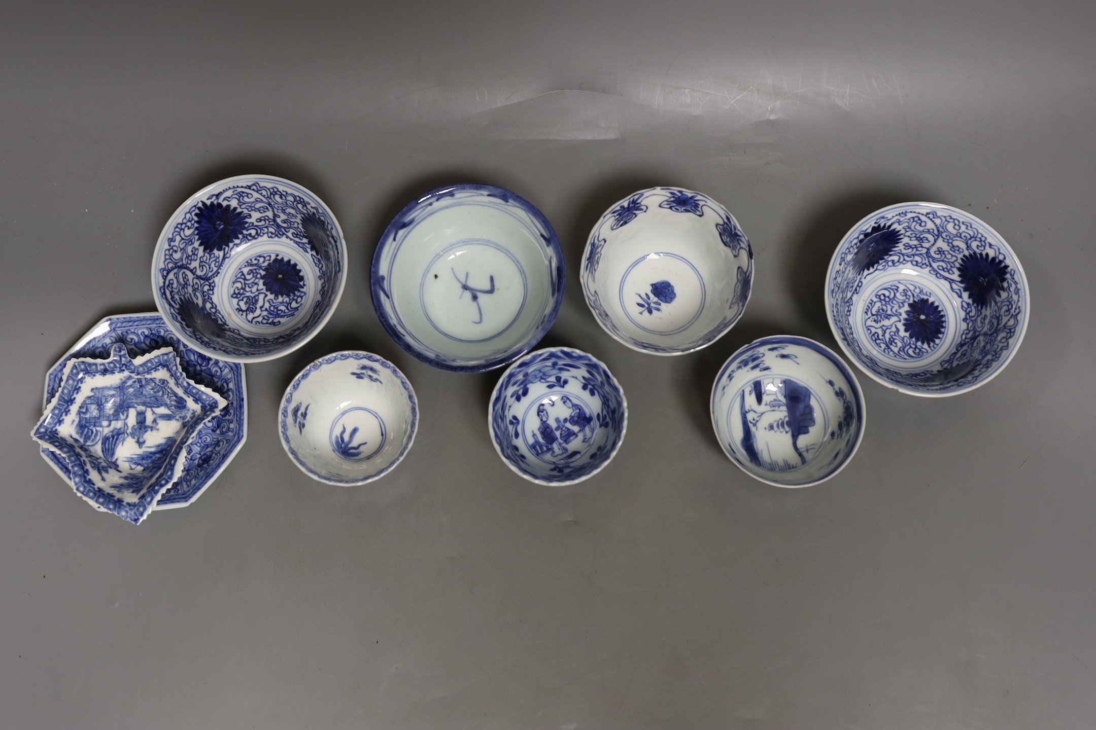 A group of Chinese blue and white tea bowls, 18th century a saucer and a in English porcelain leaf dish